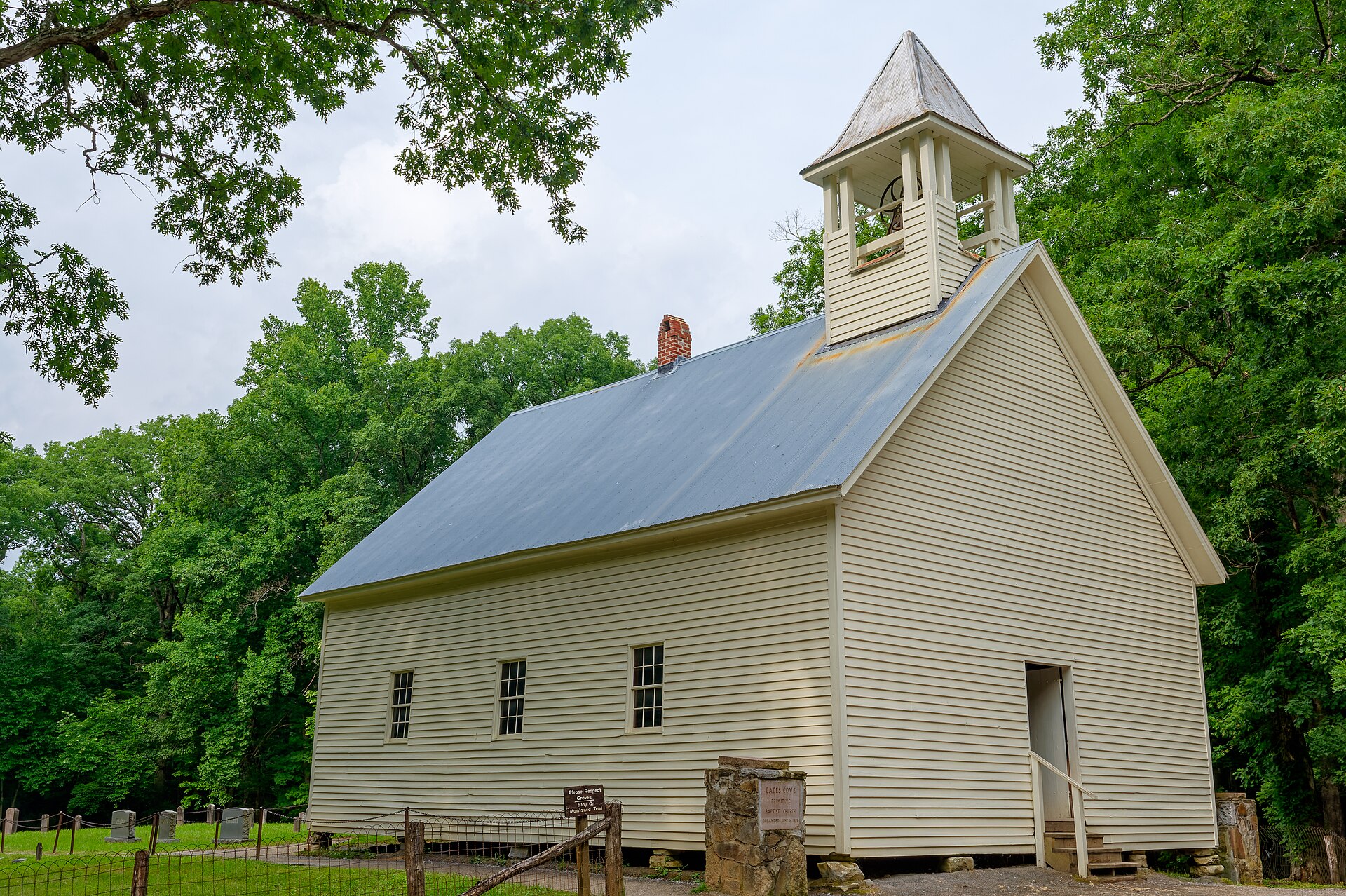 Primitive Baptist Church at Cades Cove surrounded by trees