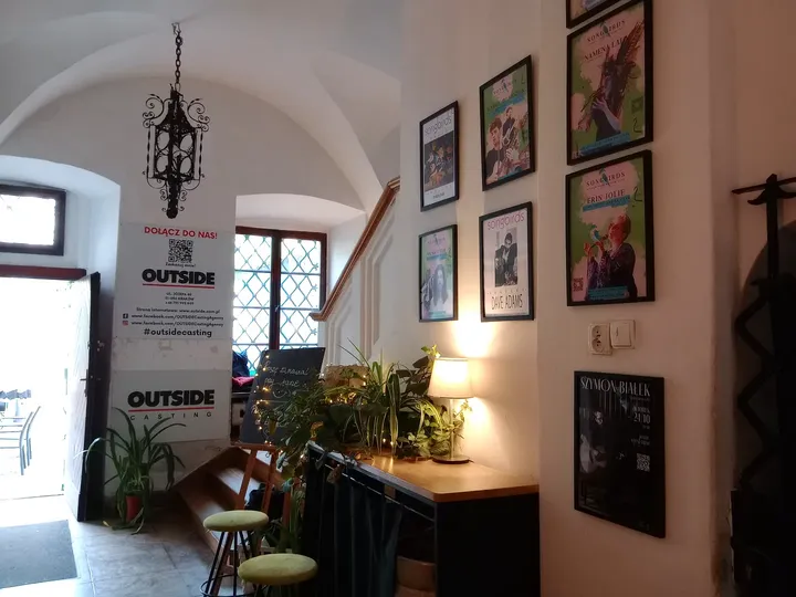 Pictures and furnishings beside the window at 2 Okna Café