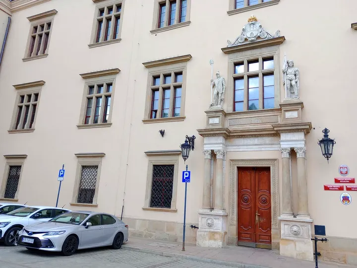 Pale municipal palace frontage at All Saints Square, Kraków