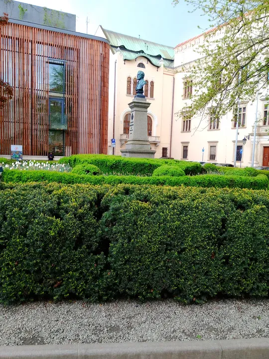Church beyond the formal garden at All Saints Square, Kraków