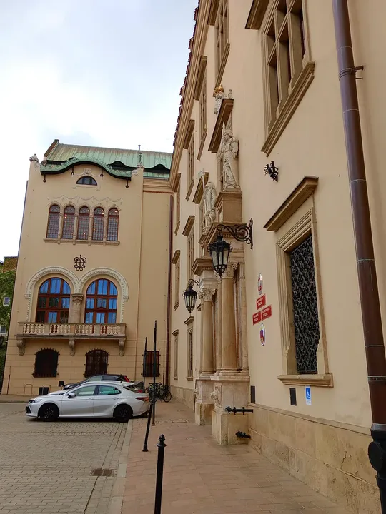 Arched entrance along the street at All Saints Square, Kraków