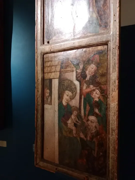 A painted panel beside a doorway at Archdiocesan Museum, Kraków
