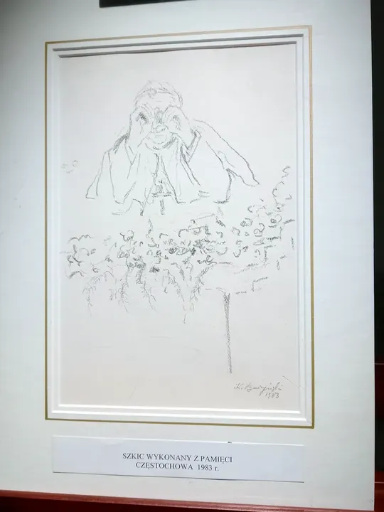 Two framed works beside a doorway at Archdiocesan Museum, Kraków