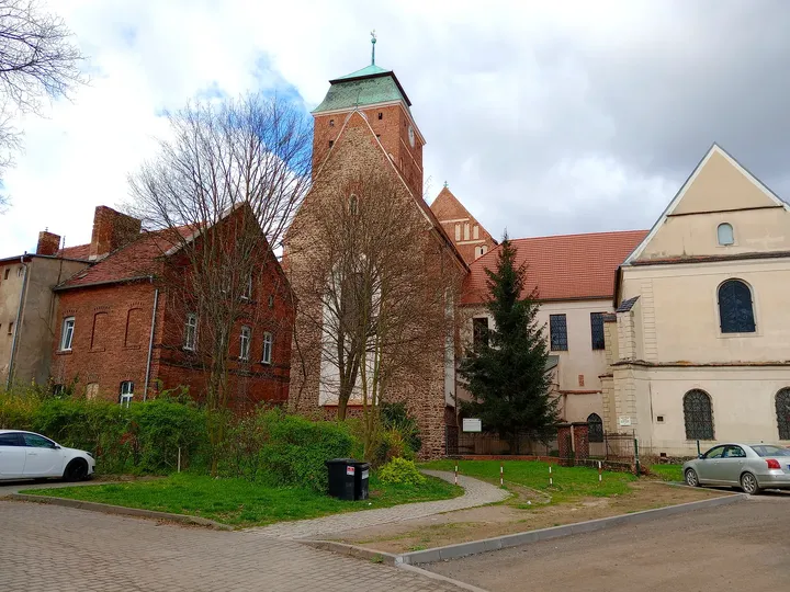 The church-side buildings and open square at Assumption Church, Żagań