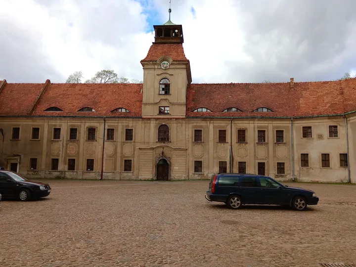 The church and monastery across the forecourt at Assumption Church, Żagań