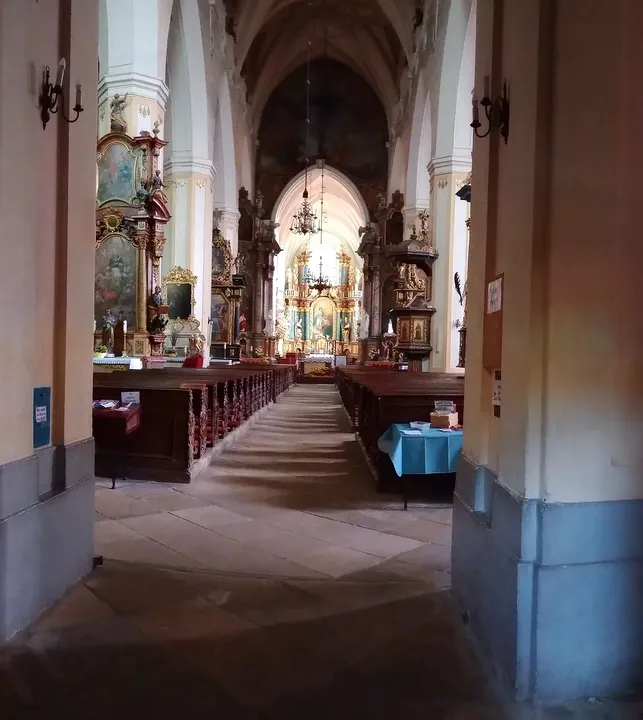 The church interior beyond the doorway at Assumption Church, Żagań