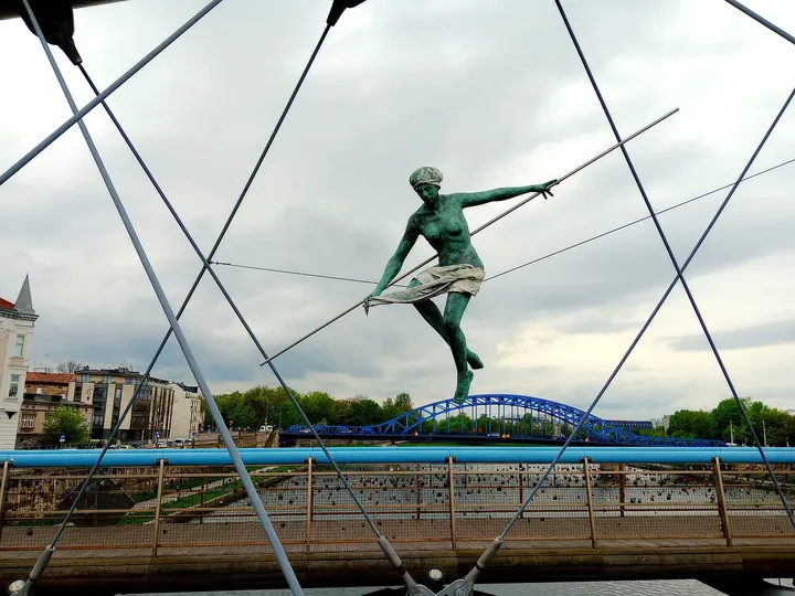 Balancing sculpture between the bridge cables at Between Water and Sky sculptures