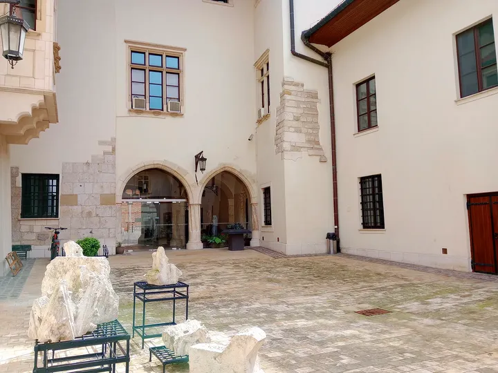 The approach through the palace courtyard at Bishop Erazm Ciołek Palace