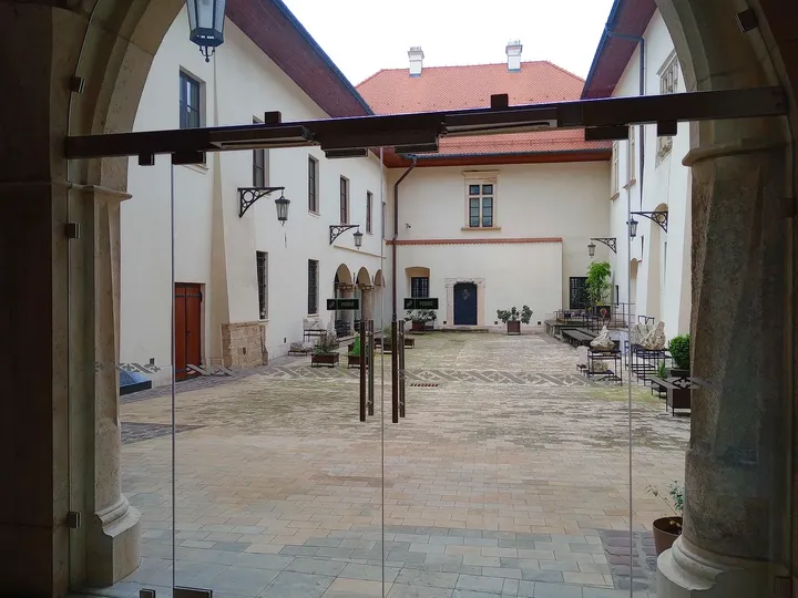 The palace courtyard and windows at Bishop Erazm Ciołek Palace
