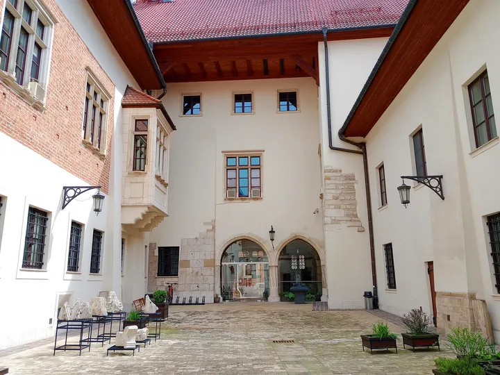The lower arcade and courtyard paving at Bishop Erazm Ciołek Palace