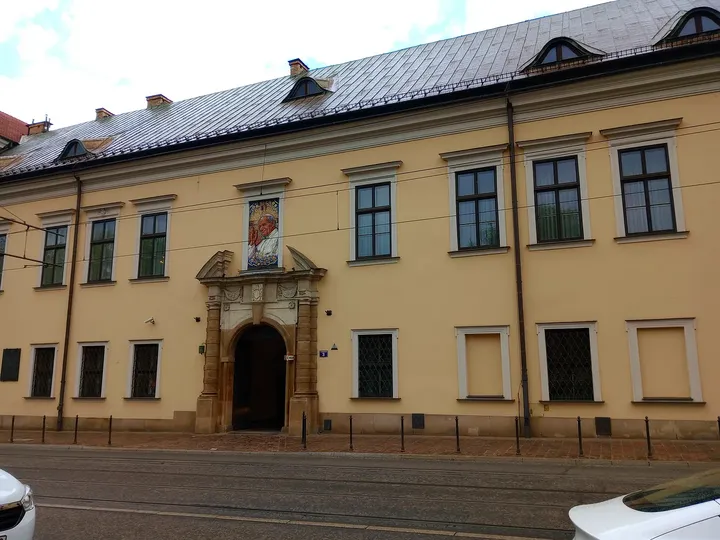 Yellow palace frontage and arched portal at Bishops’ Palace, Kraków
