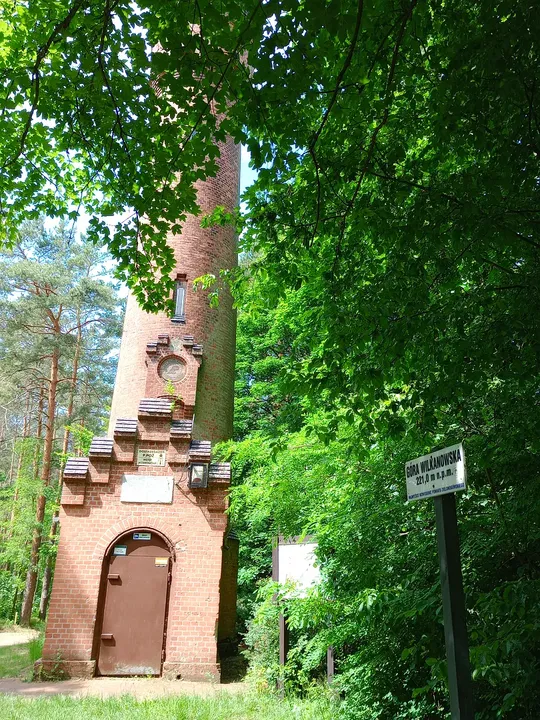 Observation tower between the trees at Black walking trail to Wilkanowo Hill