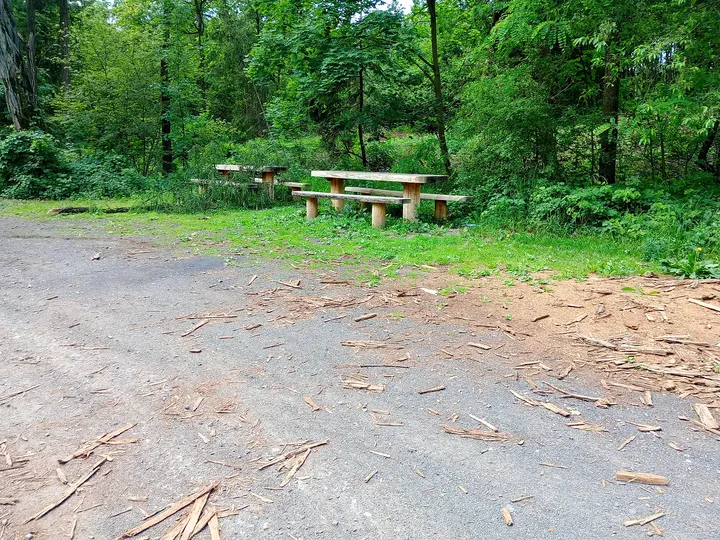 Picnic table near the woodland approach at Black walking trail to Wilkanowo Hill