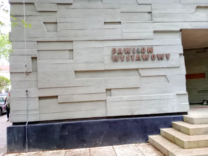 Entrance steps beneath the gallery sign at Bunkier Sztuki
