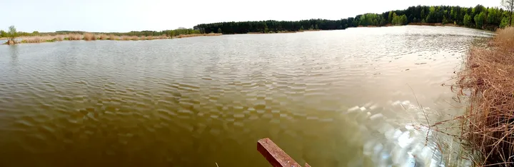 Wide view across the still water at Chalk pits, Brzezie Pomorskie