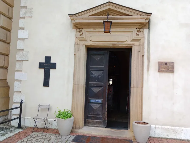 Stone entrance surround and door at Corpus Christi Basilica, Kraków