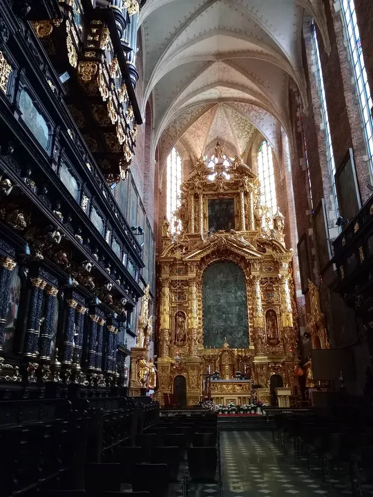 Main altar seen along the nave at Corpus Christi Basilica, Kraków