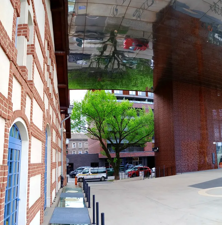 View up beneath the raised building at Cricoteka