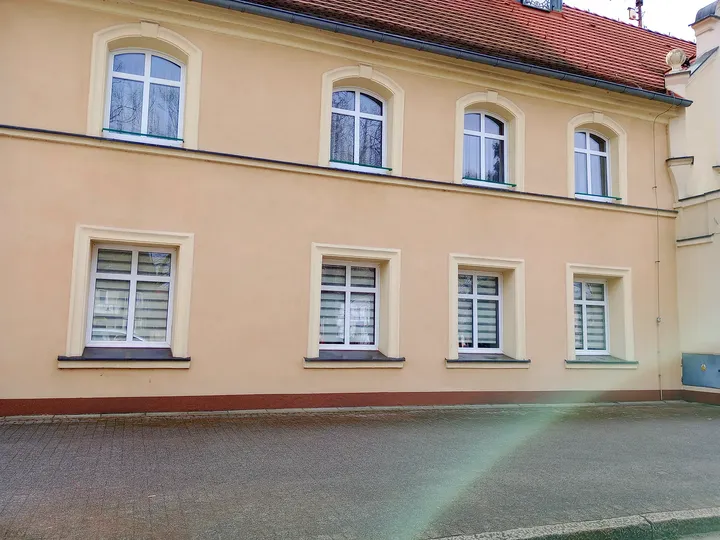 Town hall entrance and upper windows at Czerwieńsk town walk