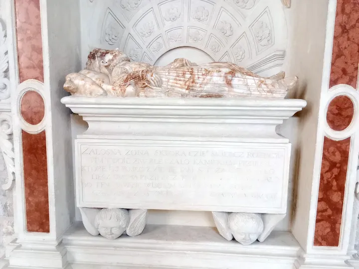A pale stone memorial at Dominican monastery, Kraków