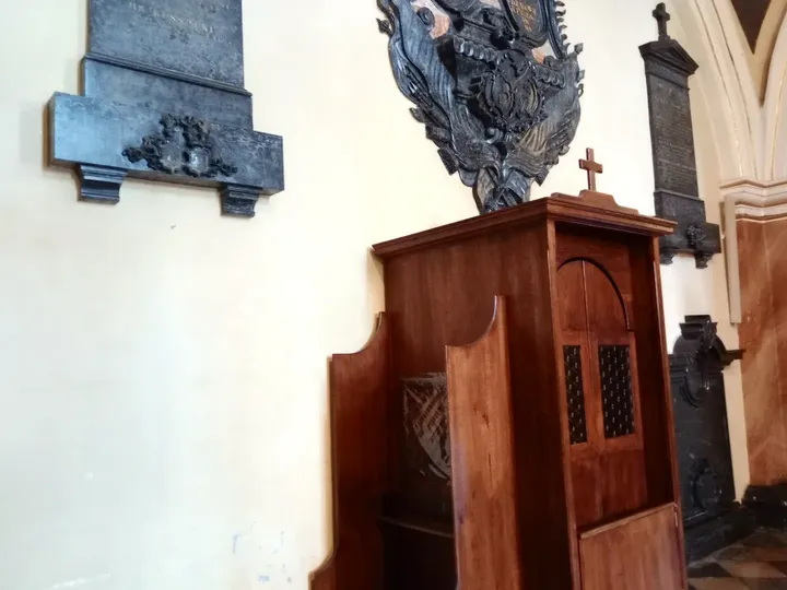 A carved furnishing beneath a memorial at Dominican monastery, Kraków