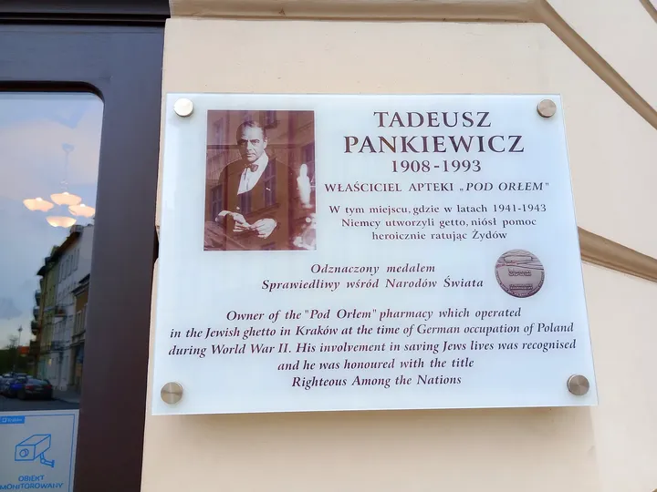 Commemorative plaque beside the entrance at Eagle Pharmacy