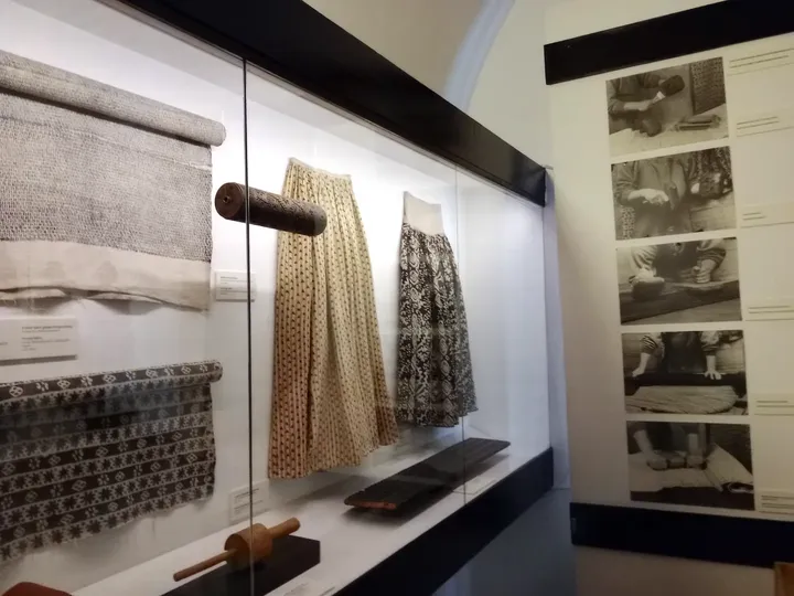 Textile materials along the display wall at Ethnographic Museum, Kraków