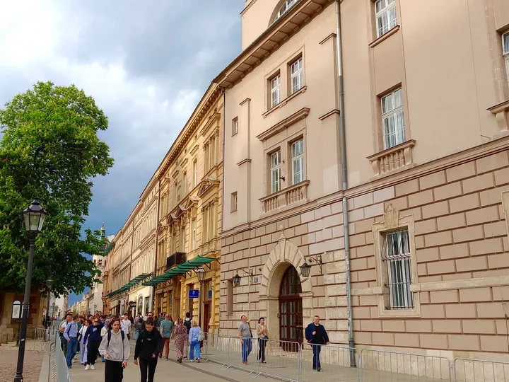 The lane between the buildings at Father Adam Studziński Square