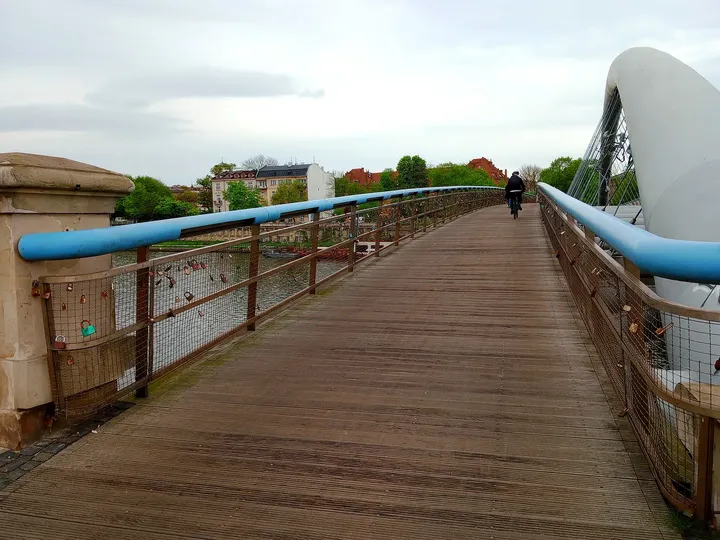 The timber deck beside the blue railing at Father Bernatek Footbridge