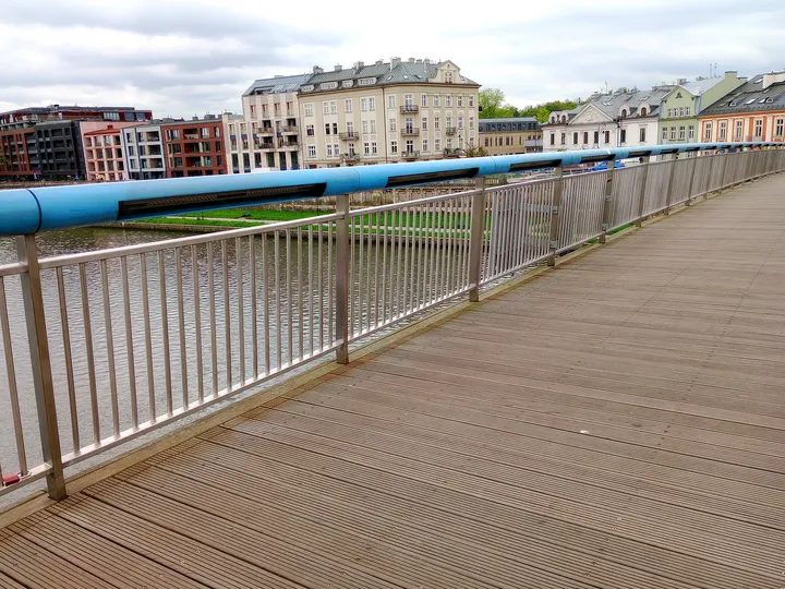 The wooden walkway beside the river view at Father Bernatek Footbridge