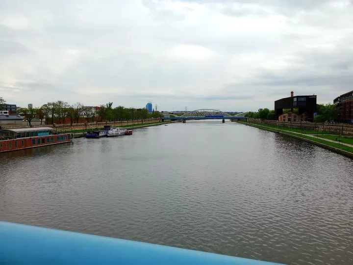 The Vistula beyond the railing at Father Bernatek Footbridge
