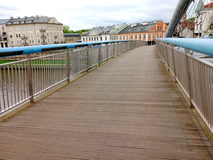 Townhouses beyond the bridge railings at Father Bernatek Footbridge