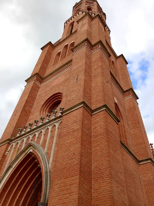 Tower viewed above the pointed arch at Former Protestant church tower, Żagań