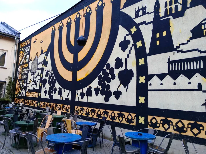 Menorah motif across the mural at Galicia Jewish Museum