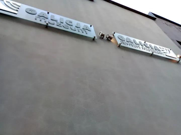 Museum name above the dark entrance at Galicia Jewish Museum