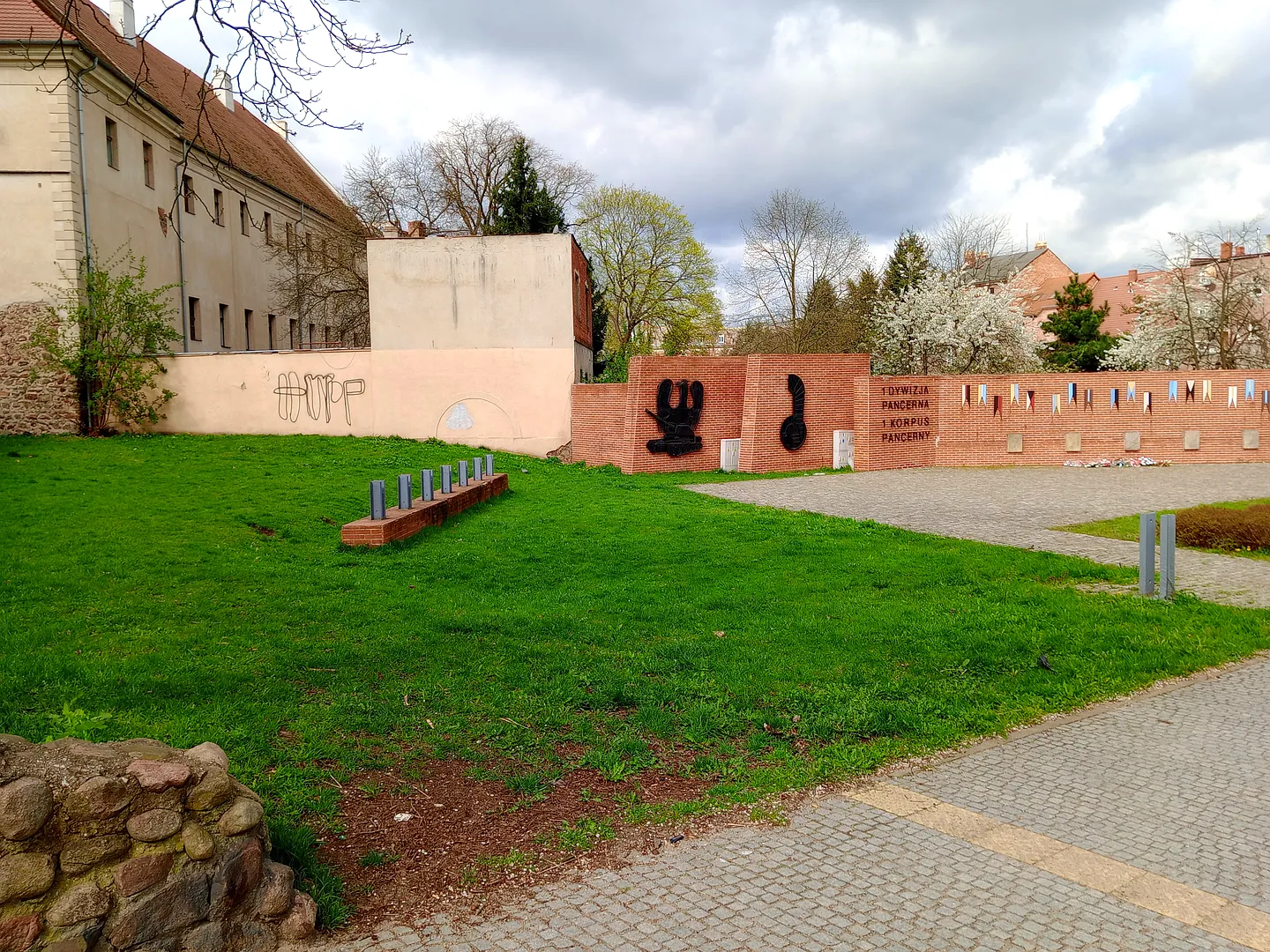 The square’s paths and lawn at General Maczek Square, Żagań