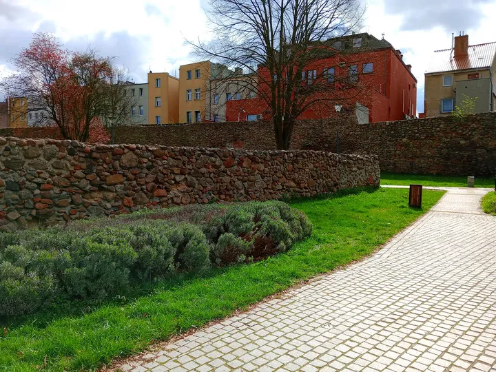 Brick remains within the garden at General Maczek Square, Żagań