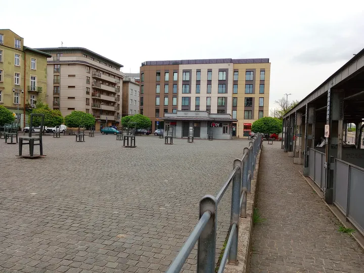 The square beside its boundary railing at Ghetto Heroes Square