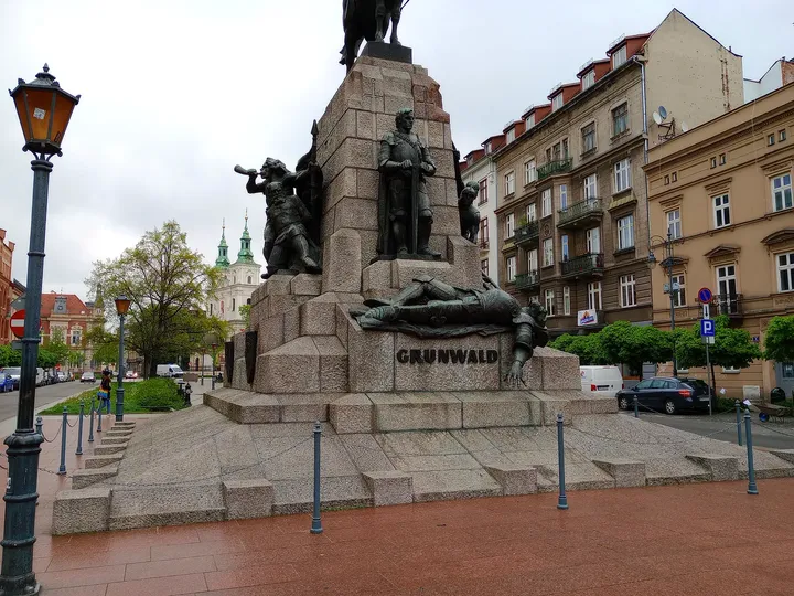 The monument beside the square’s paving at Grunwald Monument