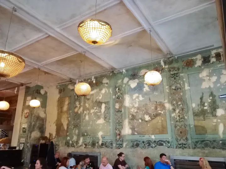 Wall paintings above the interior seating at Hevre
