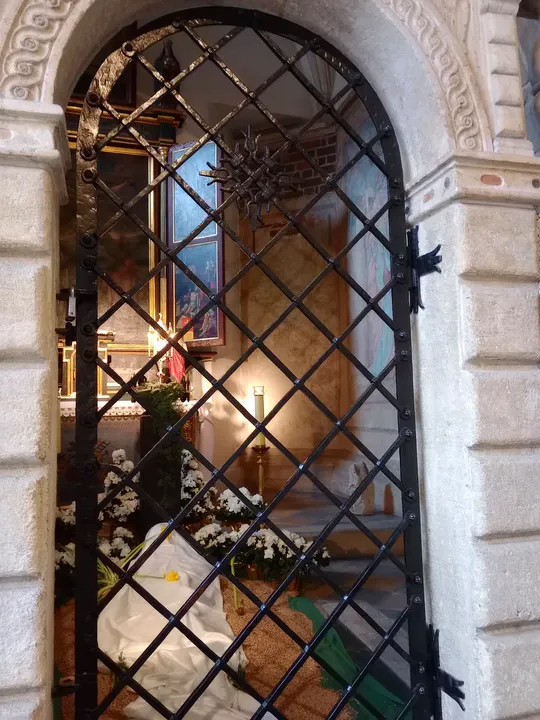 The grille beside the entrance at Holy Cross Church, Kraków