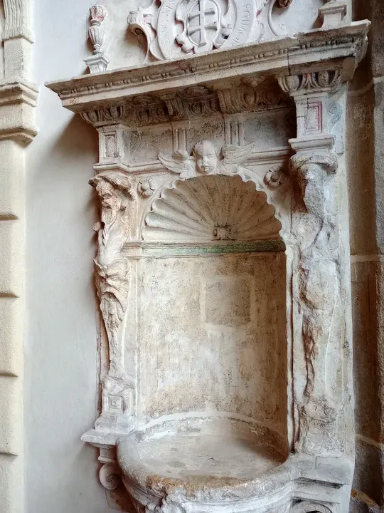 A carved stone recess at Holy Cross Church, Kraków