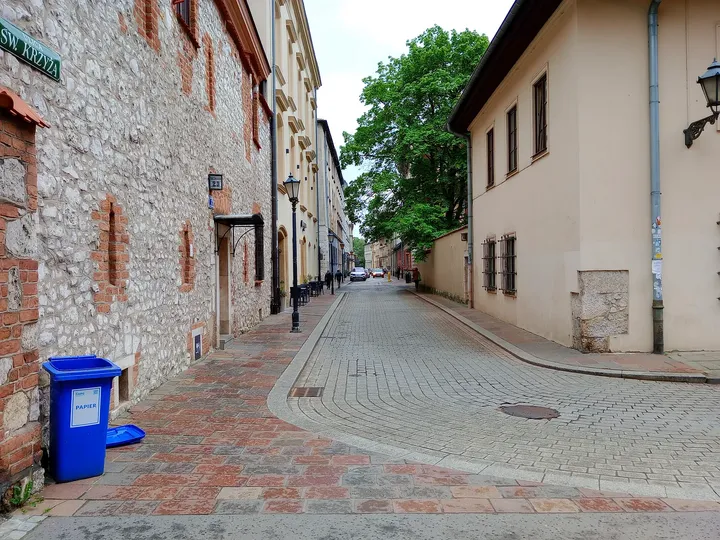 Narrow passage beside the older masonry at Holy Cross presbytery, Kraków