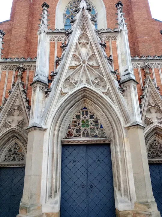 The carved portal around the main doors at Holy Trinity Basilica, Kraków