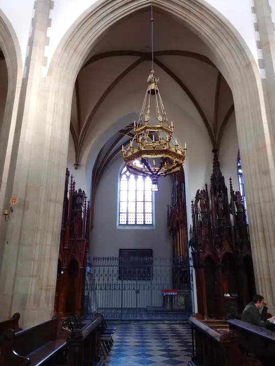 A high window above the arched passage at Holy Trinity Basilica, Kraków