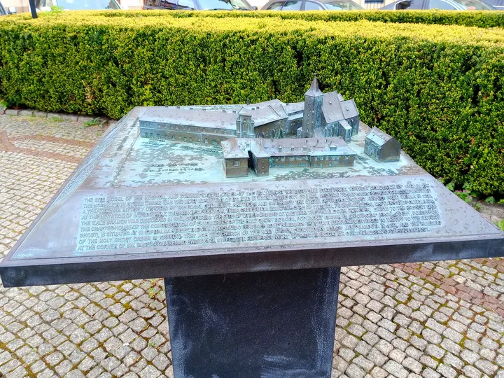 The tactile model beside the path at Jacek Woźniakowski Square