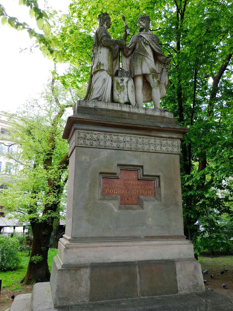 The monument and its carved pedestal at Jadwiga and Jagiełło monument