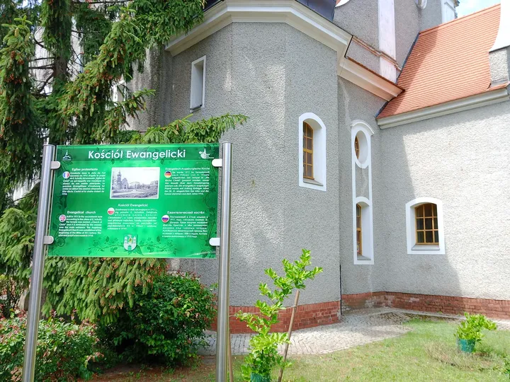 The church entrance beside the planted grounds at Jesus Church, Zielona Góra