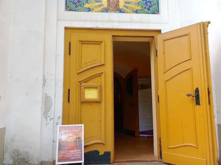 The open timber entrance doors at Jesus Church, Zielona Góra