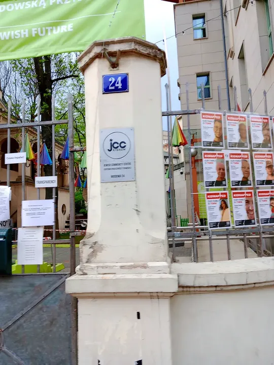A displayed notice beside the gate at Jewish Community Centre, Kraków